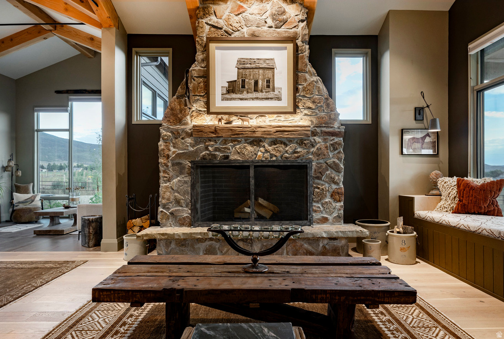 Central stone fireplace with a substantial wood mantel