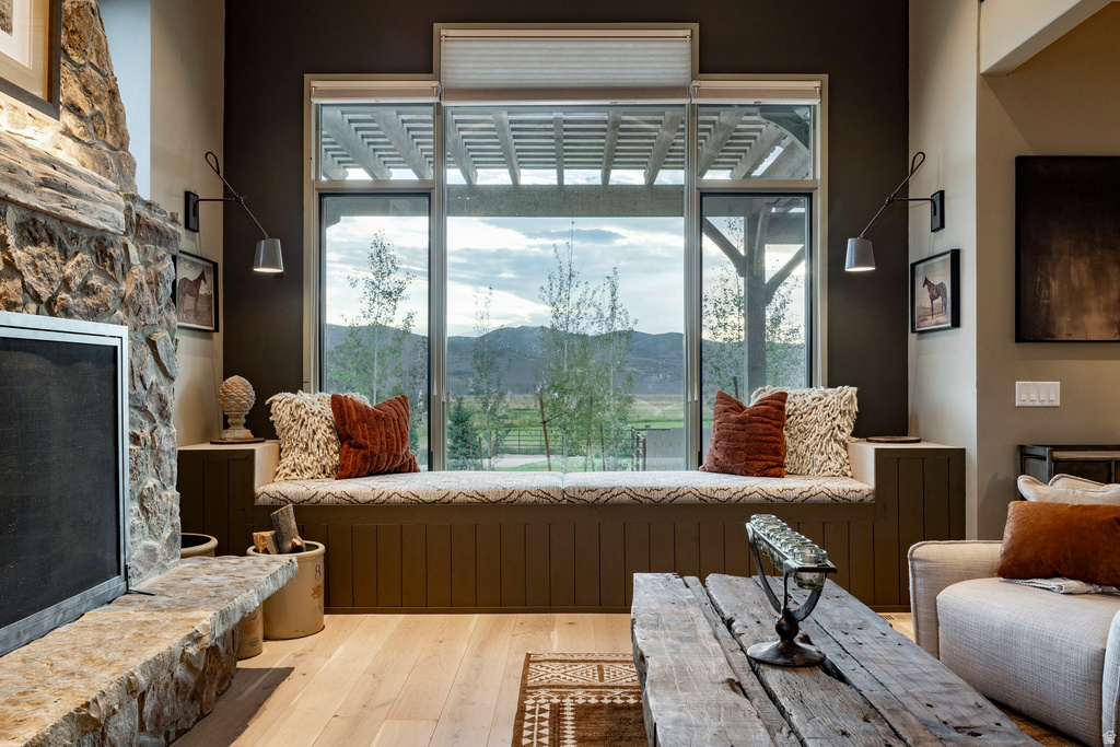 Window seat with integrated storage, featuring a large window with mountain scenery
