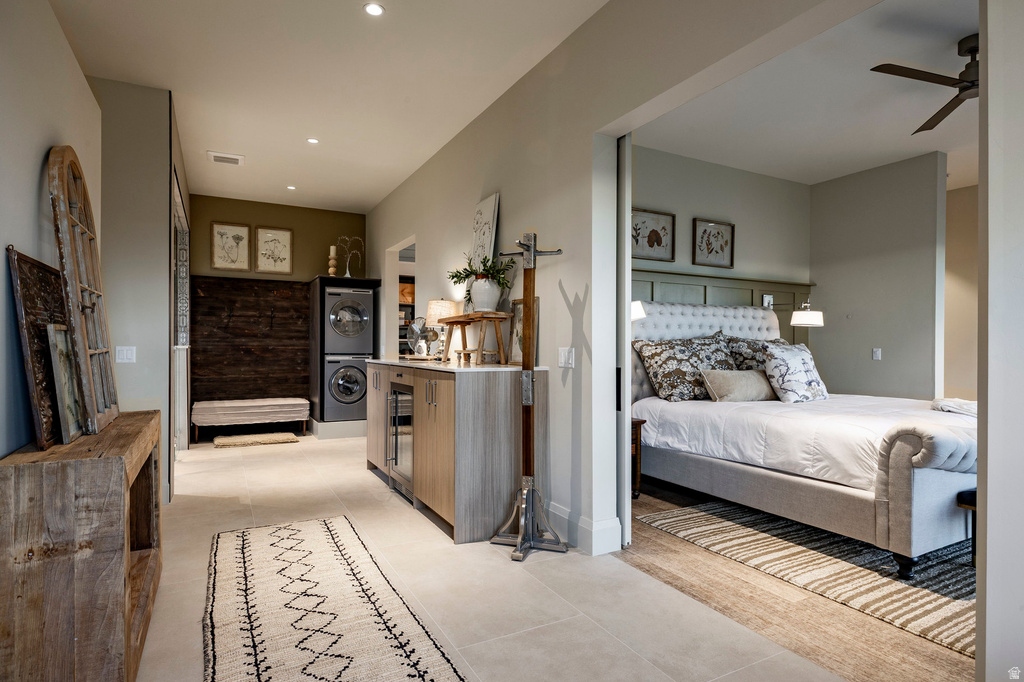 Tiled flooring throughout the hallway, leading to a bedroom with carpet