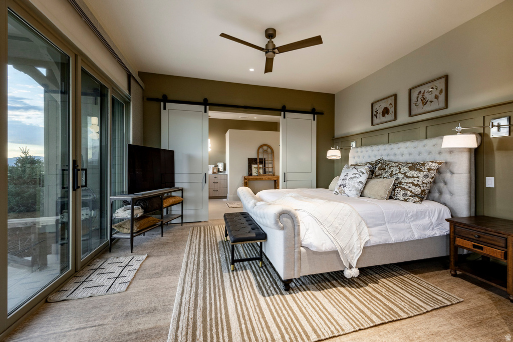Spacious room featuring broad sliding glass doors, a ceiling fan, and recessed lighting