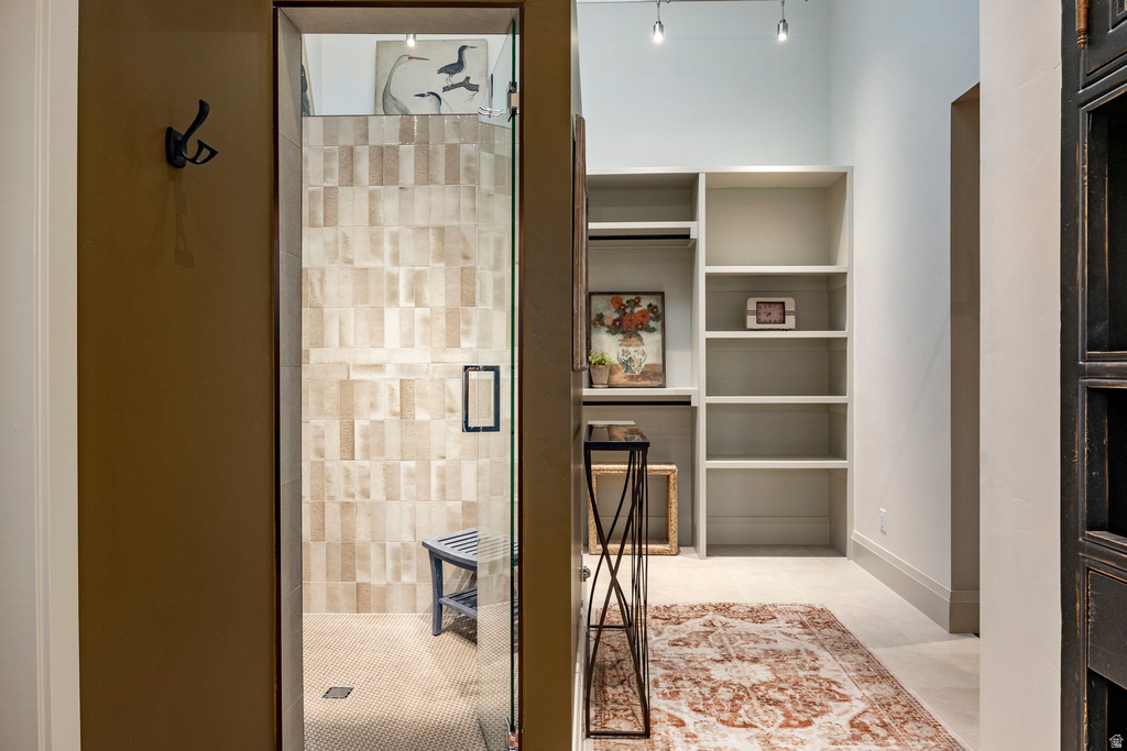 Walk-in shower with textured subway tile surround