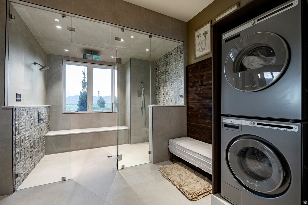 Spacious bathroom featuring a glass-enclosed shower with tiled walls and a built-in bench
