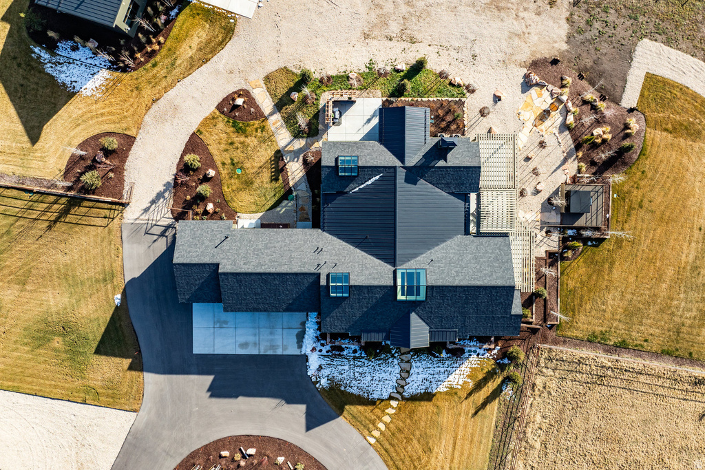 Contemporary-style residence featuring multiple rooflines and skylights