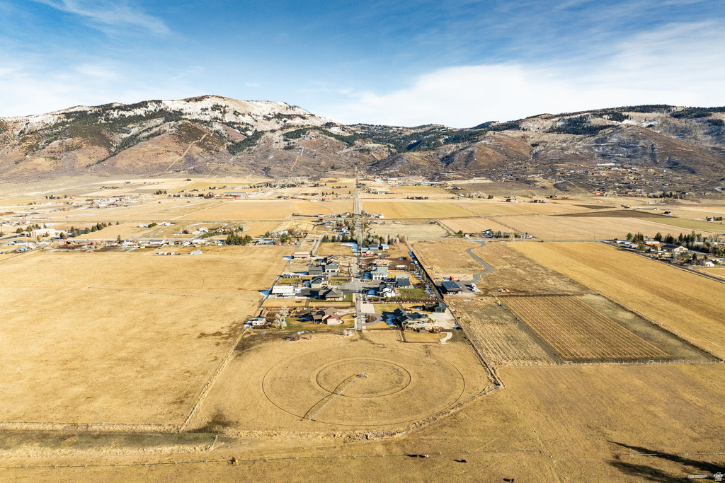 Expansive rural landscape featuring a scattering of residential properties and agricultural fields