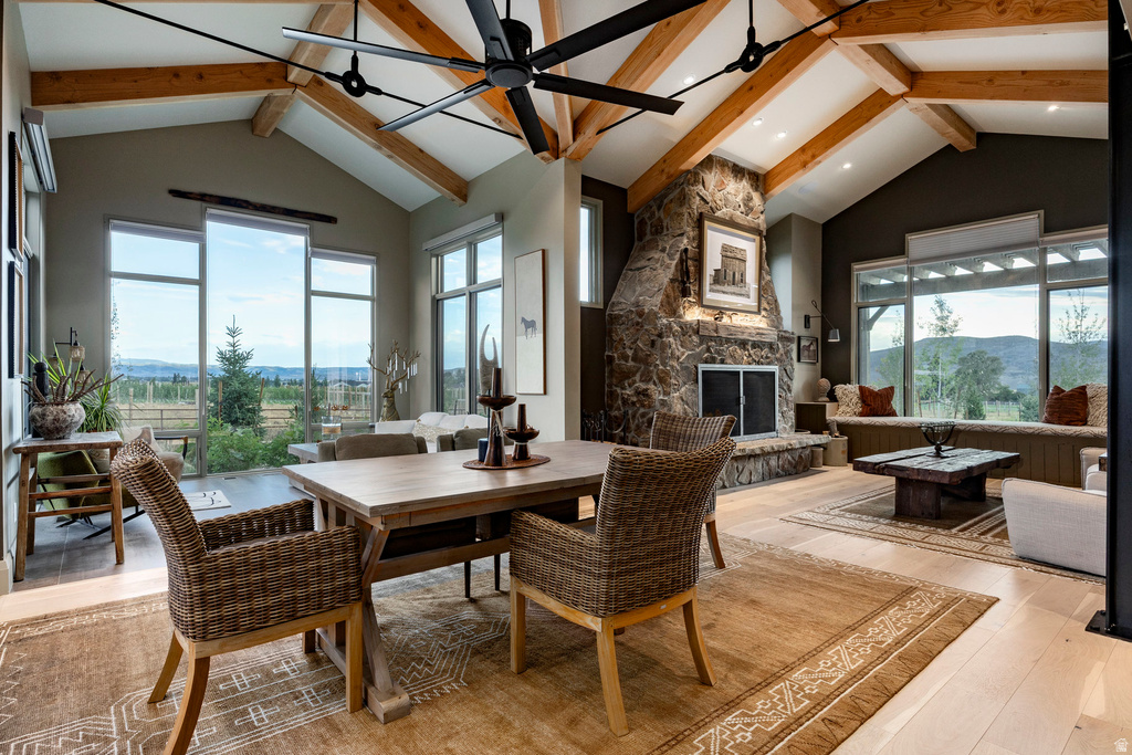 Vaulted ceiling with exposed wood beams and a contemporary ceiling fan