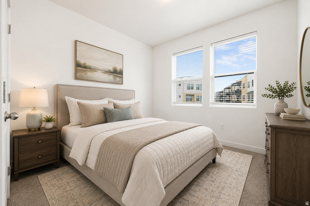 Two large windows with horizontal blinds provide natural light