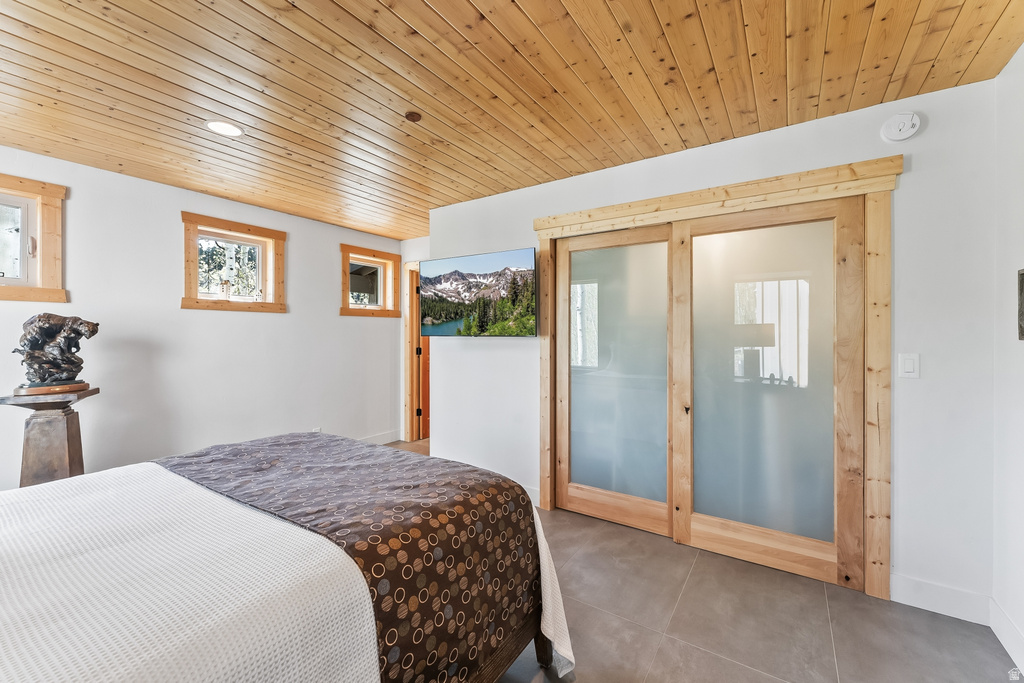 Wood-finish plank ceiling with recessed lighting