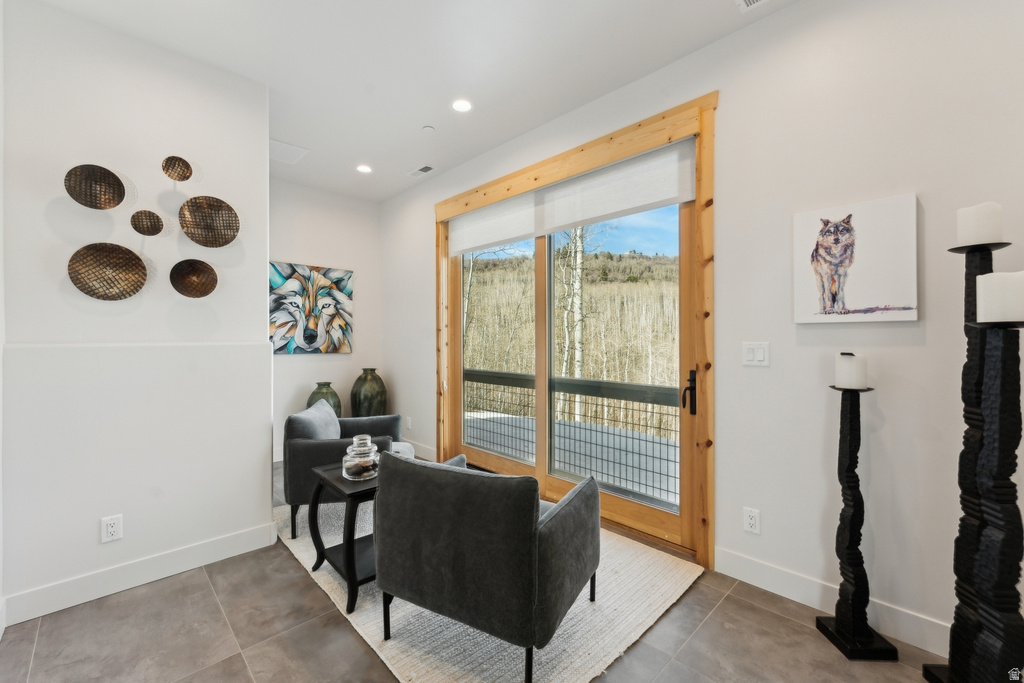 Expansive glass sliding door with natural wood framing