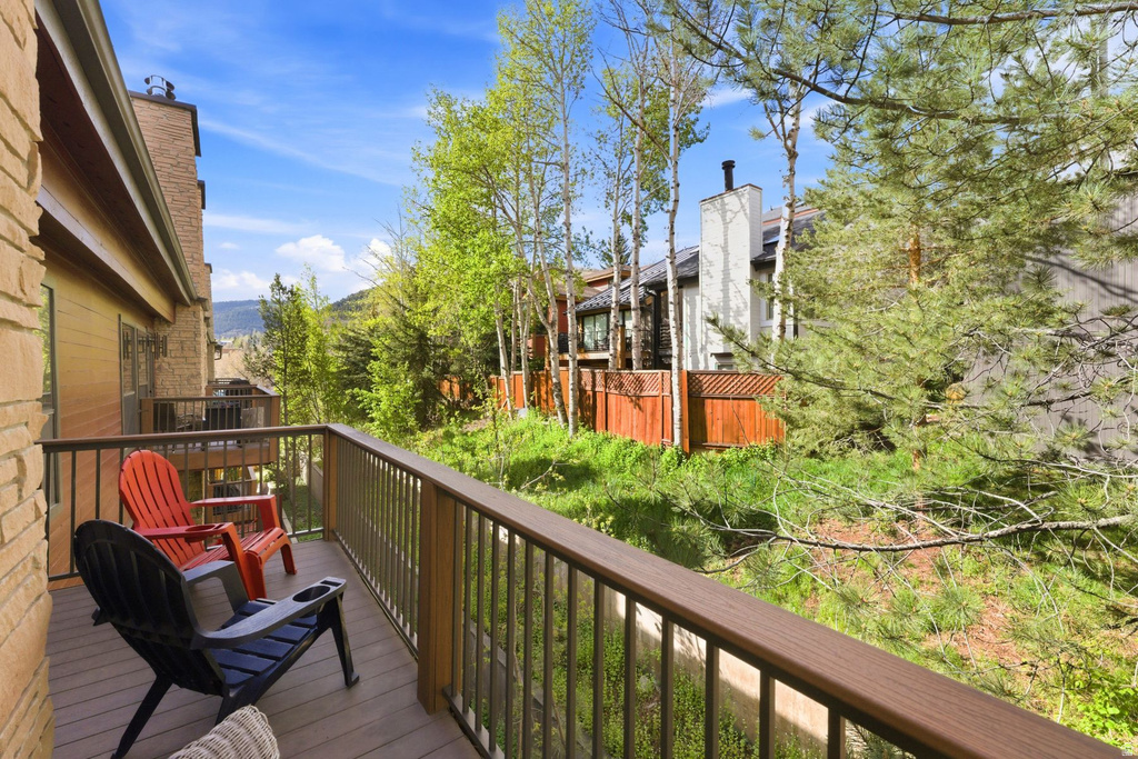 Outdoor deck featuring composite decking and dark metal railings