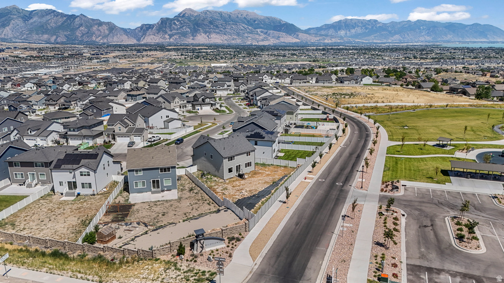 Expansive suburban development with mountain range backdrop