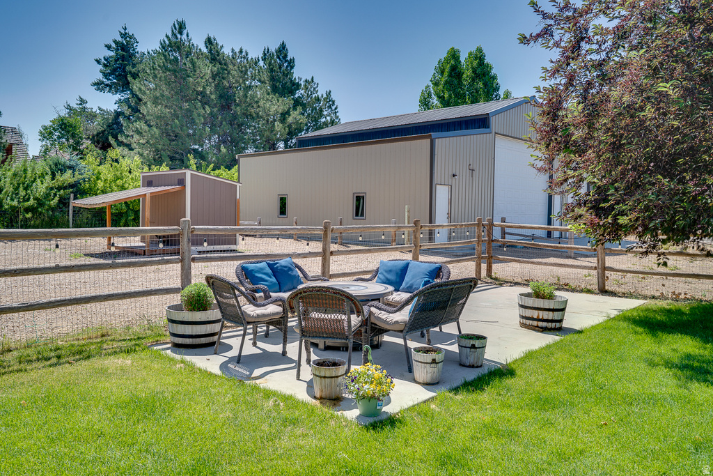 Expansive green lawn with a concrete patio