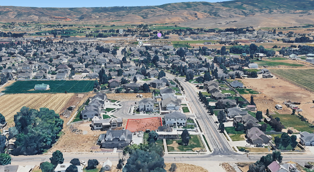 Aerial view showcasing a residential lot within a developed neighborhood