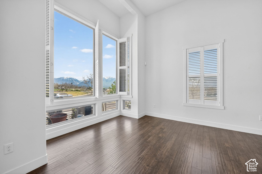 Expansive window wall with mountain backdrop