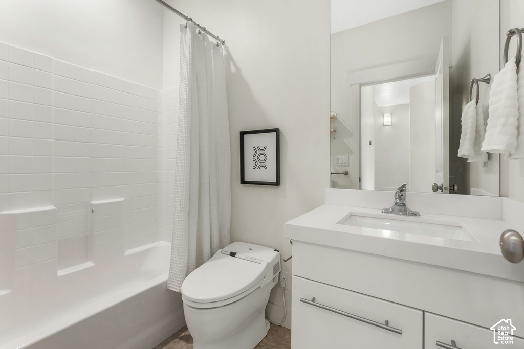 Modern bathroom featuring a white vanity with an integrated sink, polished chrome faucet, and a large wall-mounted mirror