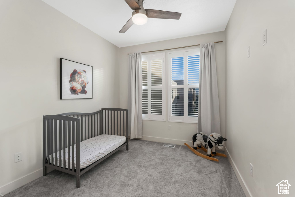 Soft gray carpeting with white baseboards throughout