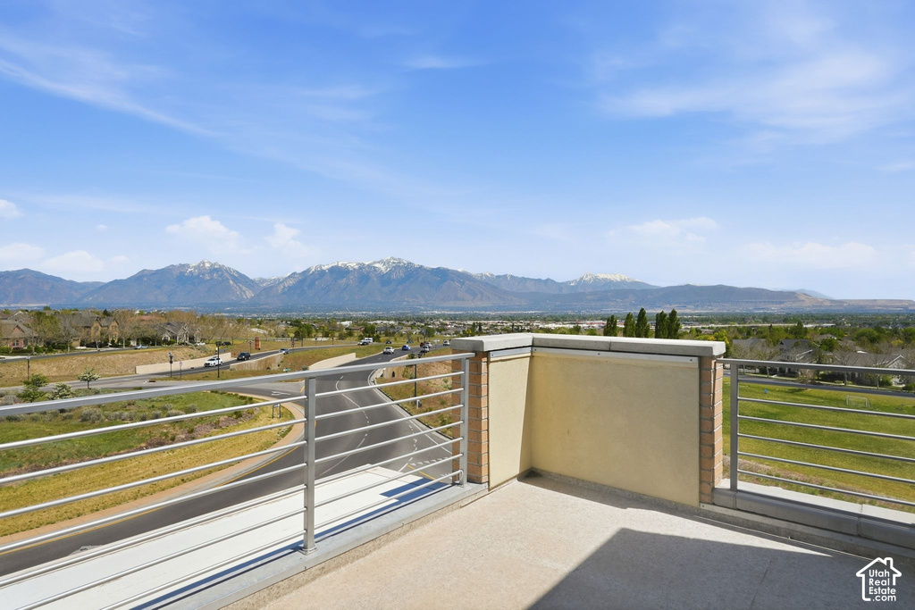 Outdoor balcony with a smooth concrete surface and modern metal railings