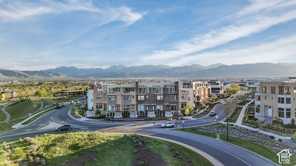 Modern architectural townhomes featuring multiple levels, balconies, and a community setting