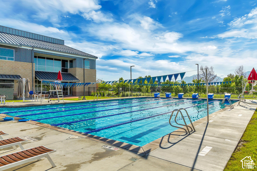 Outdoor lap pool featuring multiple lanes and starting blocks