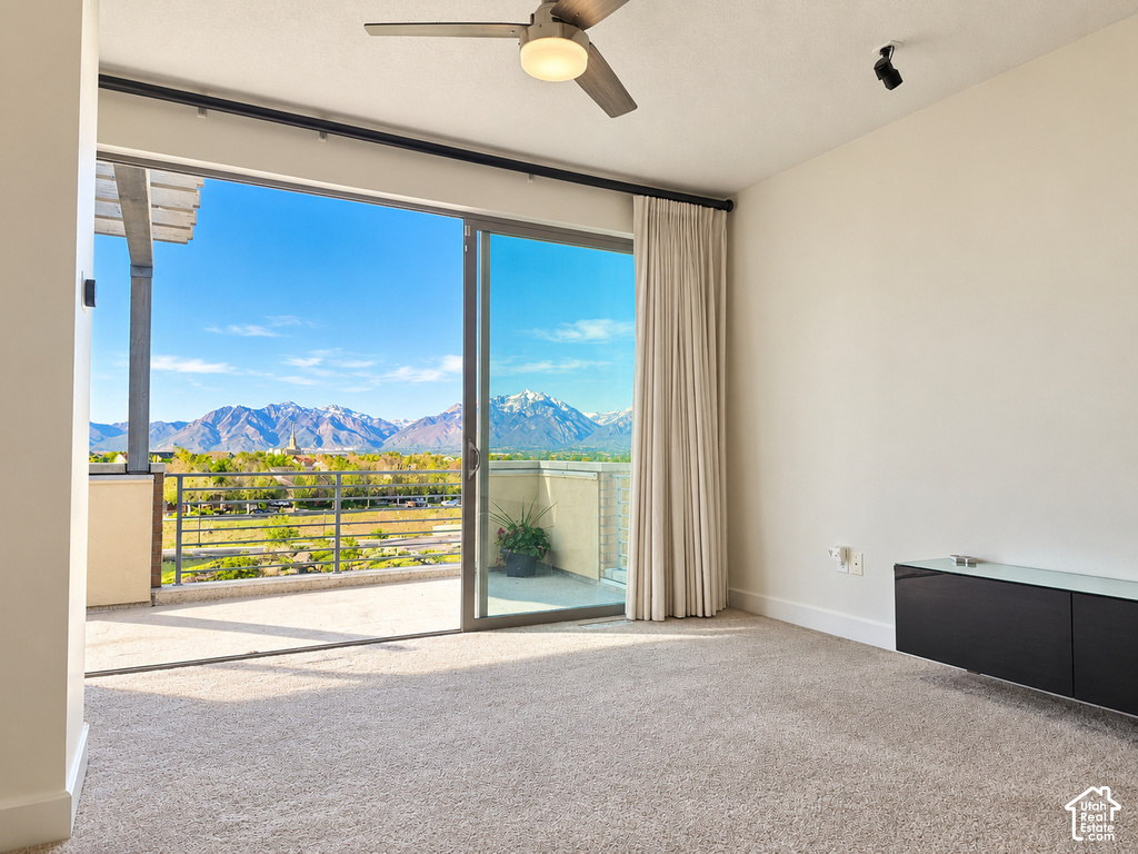 Expansive sliding glass doors open to an outdoor balcony