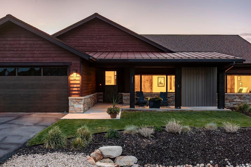 Contemporary exterior with rich wood-finish siding and stone accents