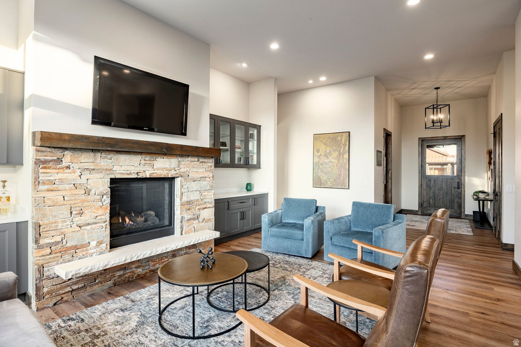 Stone-clad fireplace with a wood mantel and hearth