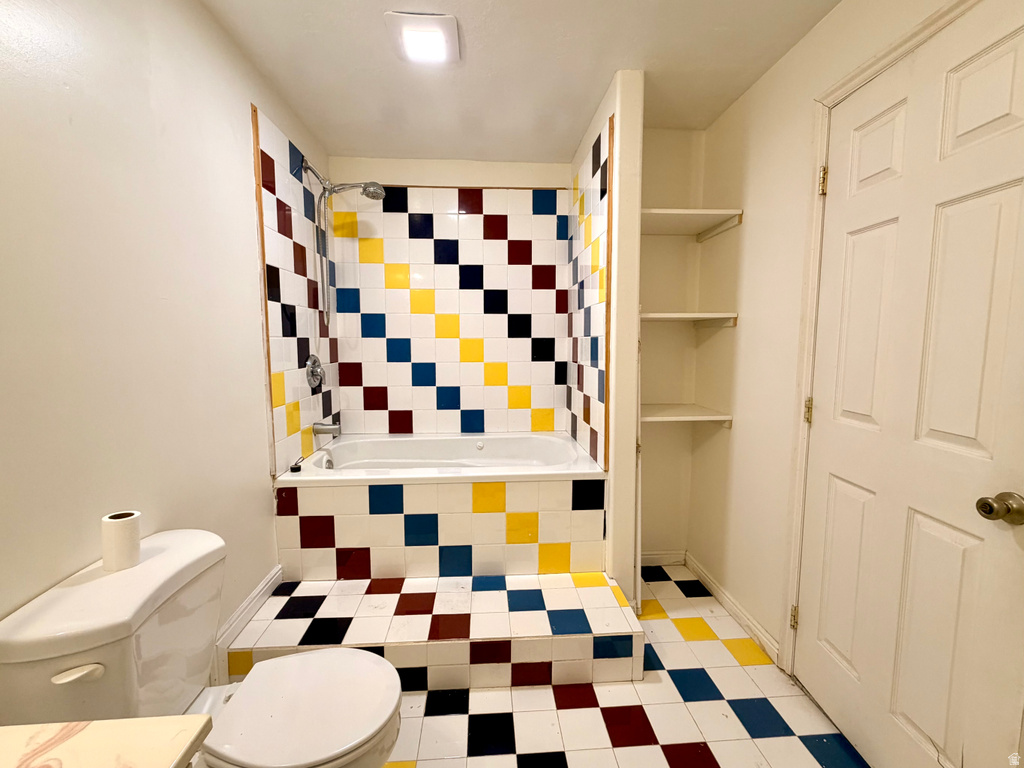Full bathroom featuring a tiled shower and bathtub combination