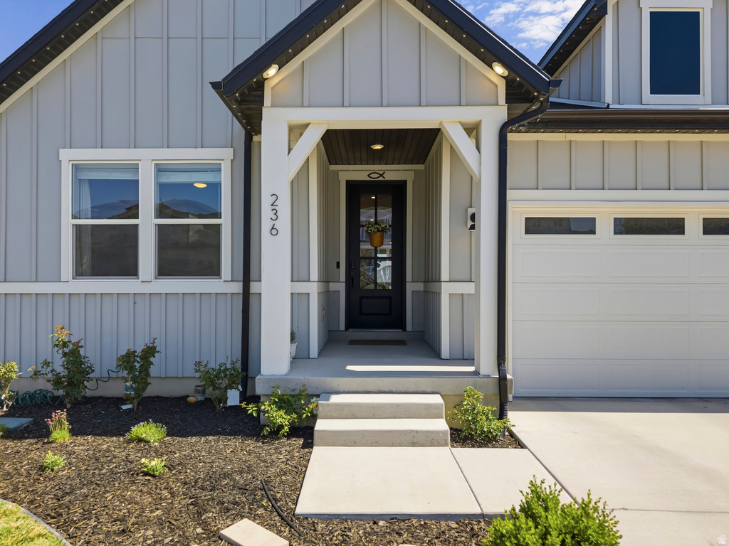 Light gray board and batten siding with white trim