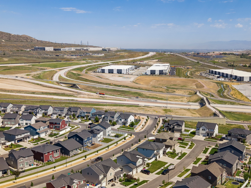 Aerial perspective showcasing a developed residential neighborhood with varied architectural styles