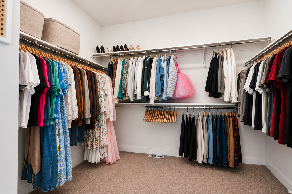 Walk-in closet featuring extensive shelving and multiple hanging rods for organization