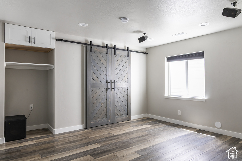 Distressed wood-finish barn doors with matte black hardware