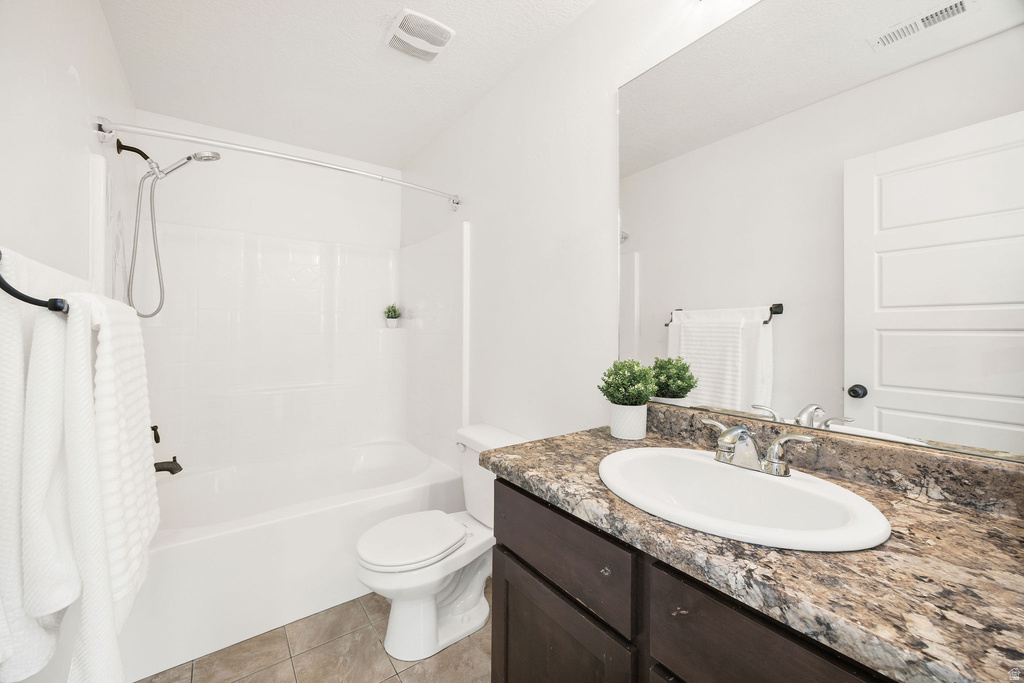 Bathroom featuring a white bathtub and shower combination with chrome fixtures