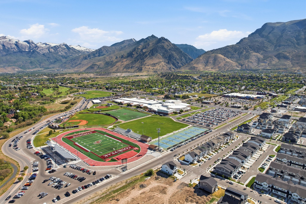 Aerial perspective showcasing a residential development with mountain backdrops