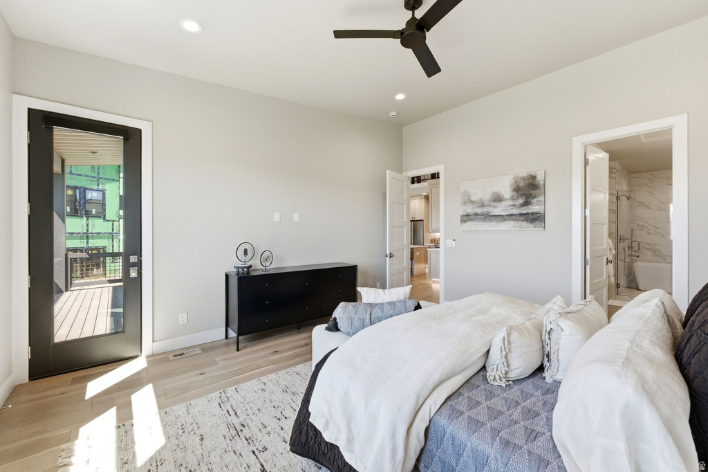 Spacious room featuring light wood-finish flooring, recessed lighting, and a contemporary ceiling fan