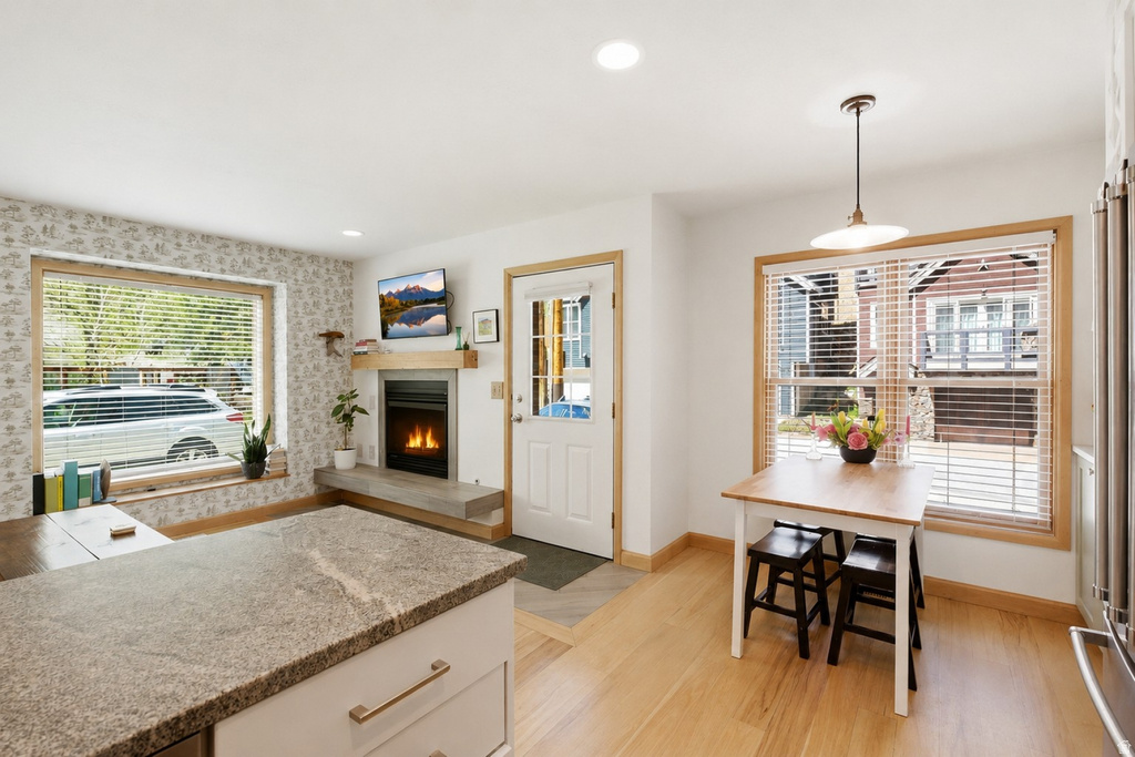 Interior space featuring light wood-finish flooring and white walls
