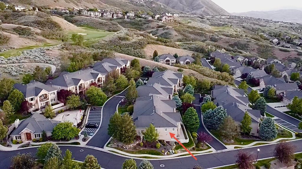 Aerial perspective showcasing a residential community with multi-story buildings and single-level structures