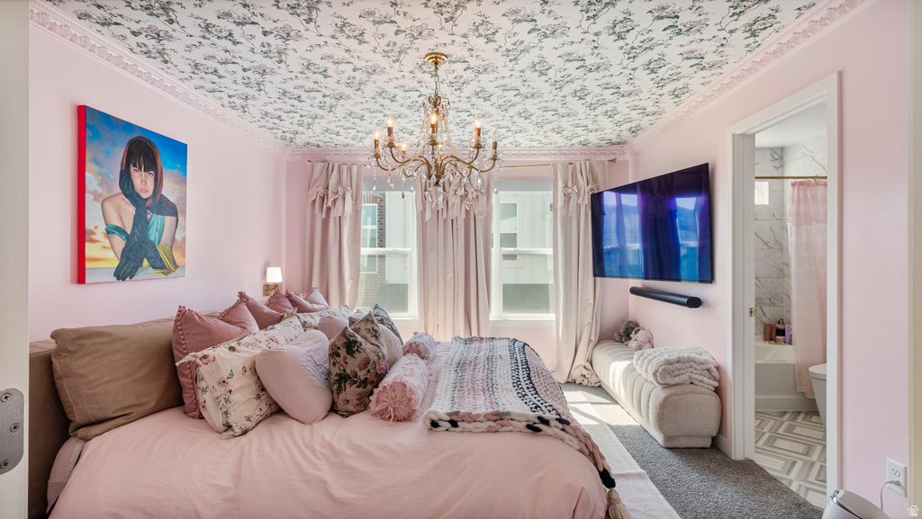 Bedroom featuring a chandelier, decorative ceiling, and wall-mounted television