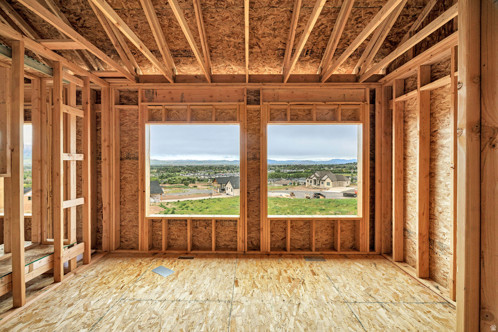 Framed interior space featuring two large window openings