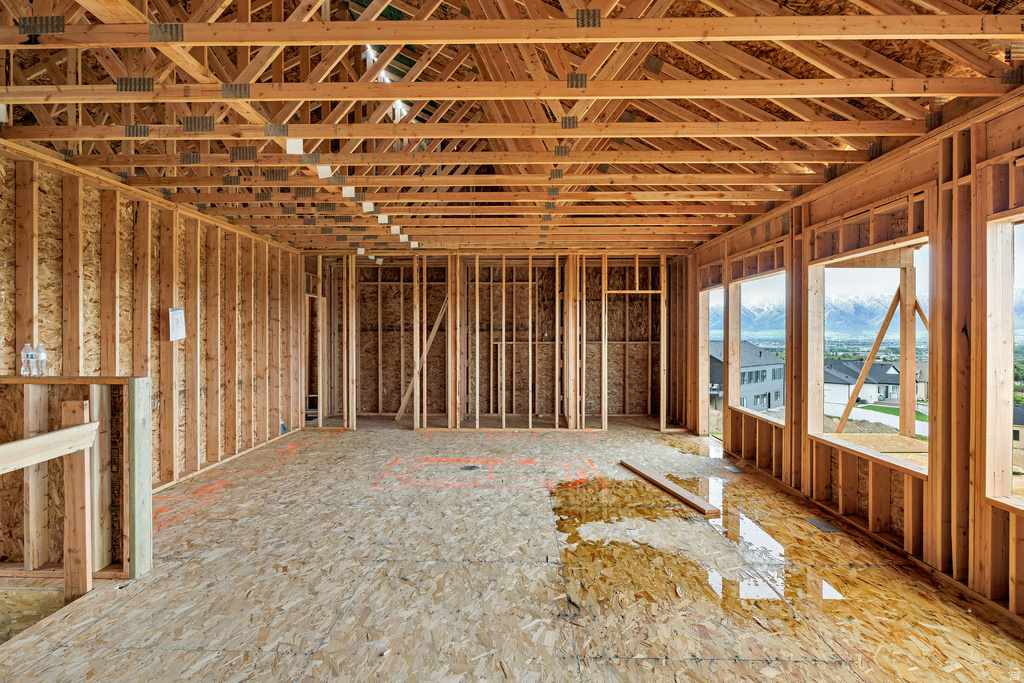 New construction framing featuring engineered wood trusses and an oriented strand board subfloor