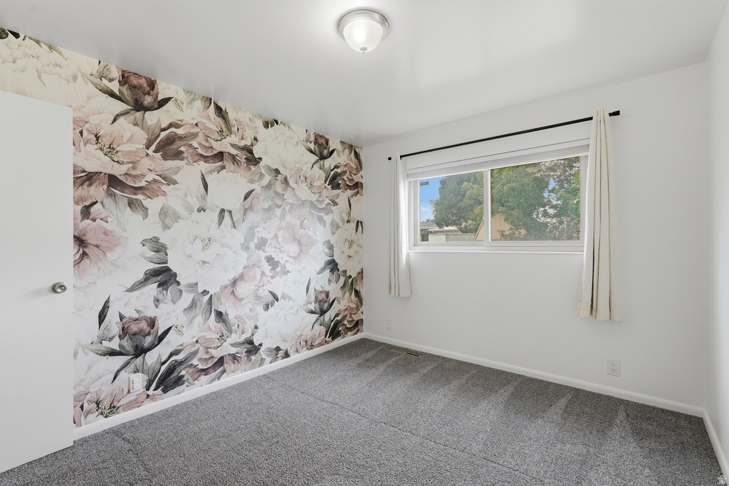 Accent wall featuring a large-scale floral pattern