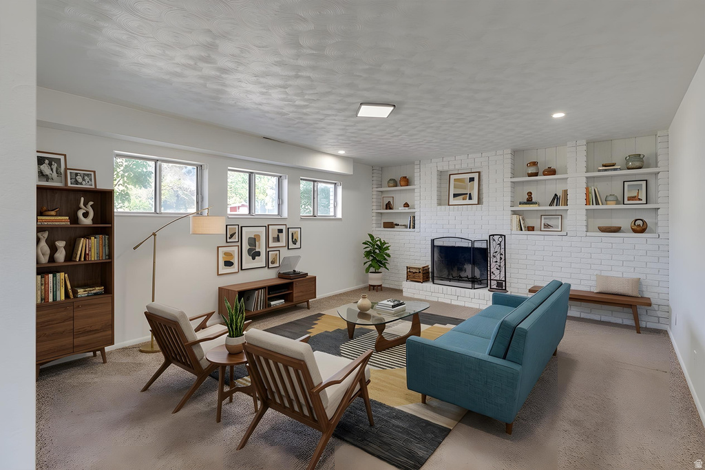 Living area featuring a brick fireplace with a metal screen