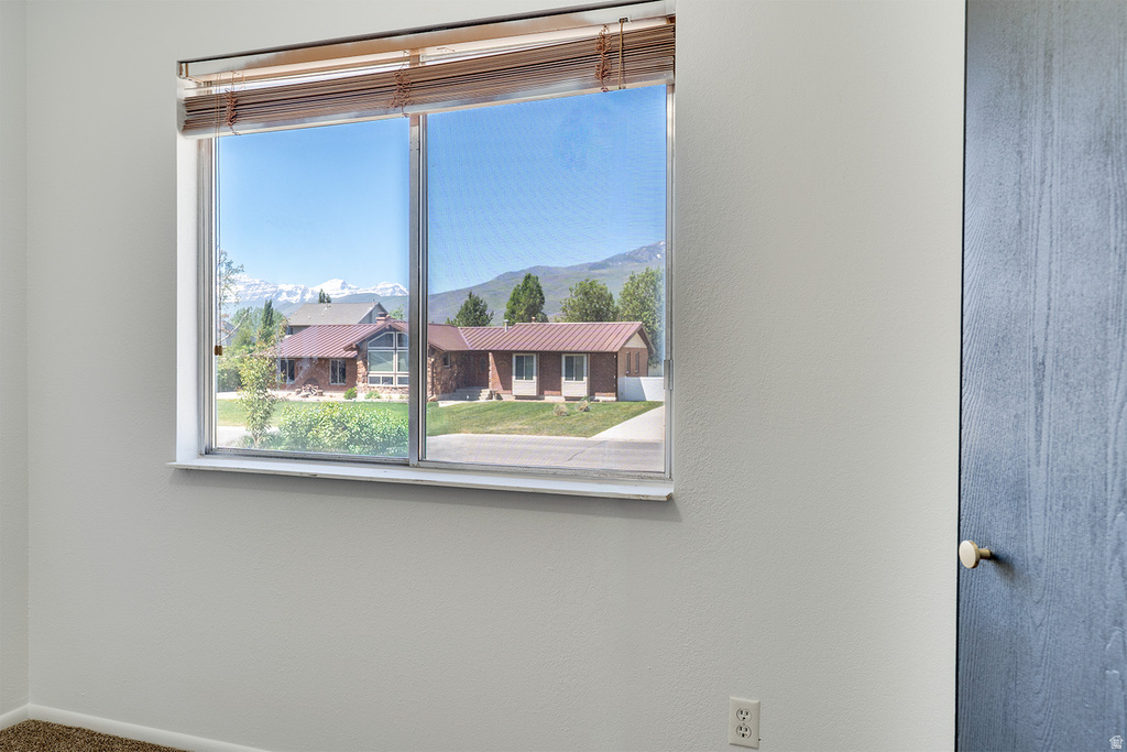 Double-pane window featuring mountain scenery