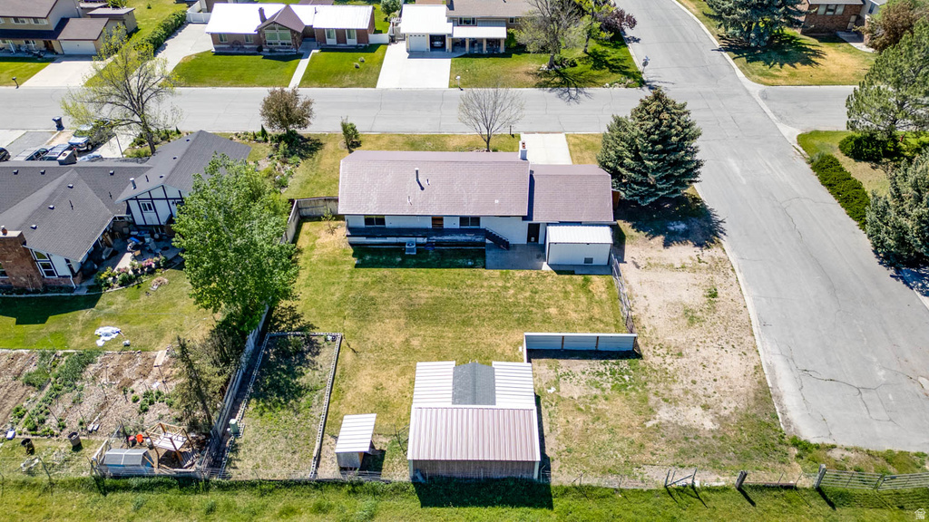 Aerial perspective showcasing a residential property with a detached accessory structure