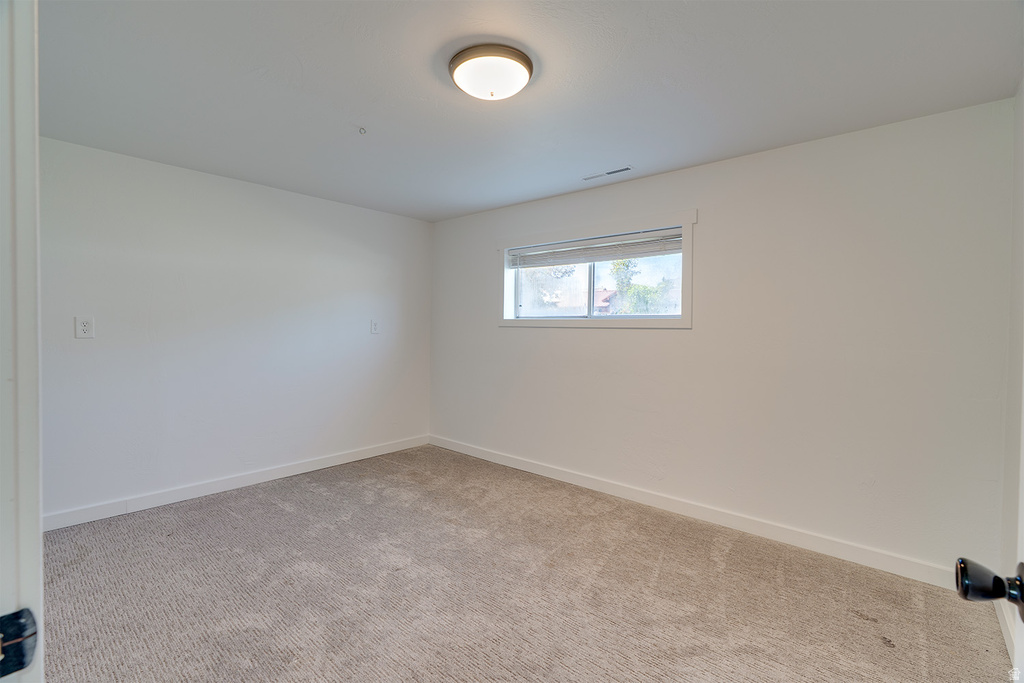 Neutral-toned carpeting paired with white walls