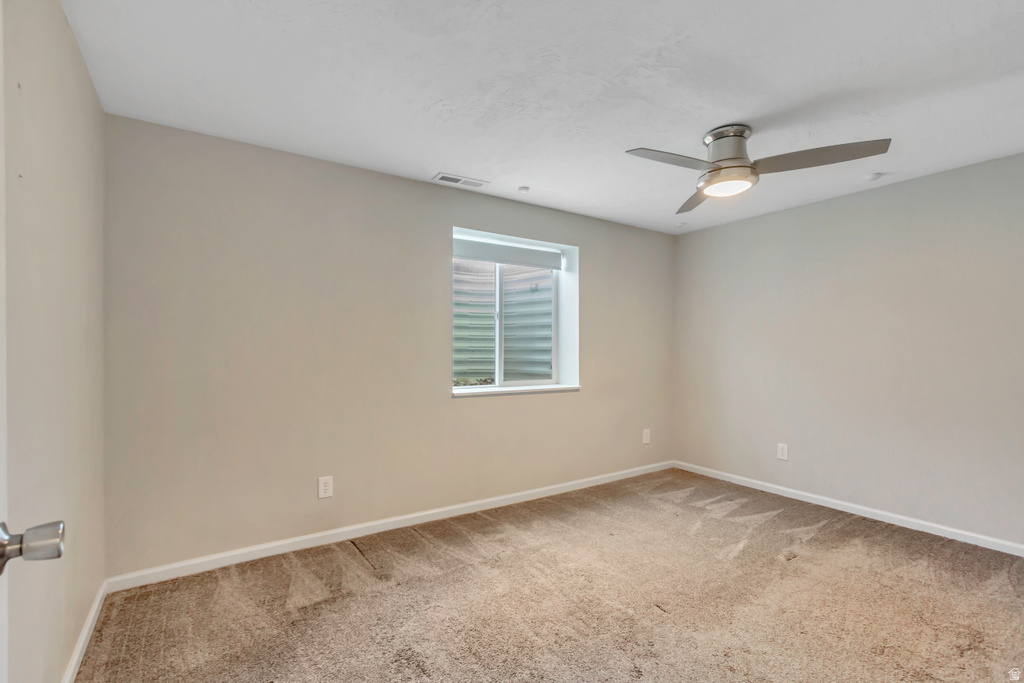 Neutral-toned wall paint with a window featuring a window well