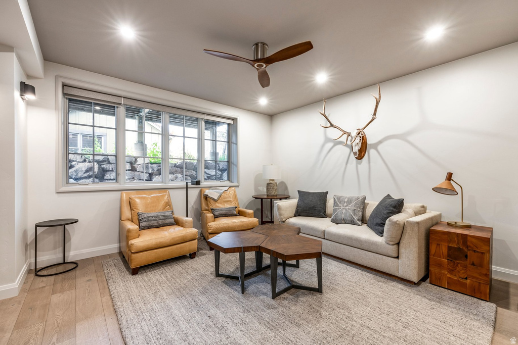 Spacious living area featuring wood-finish flooring and a large multi-pane window