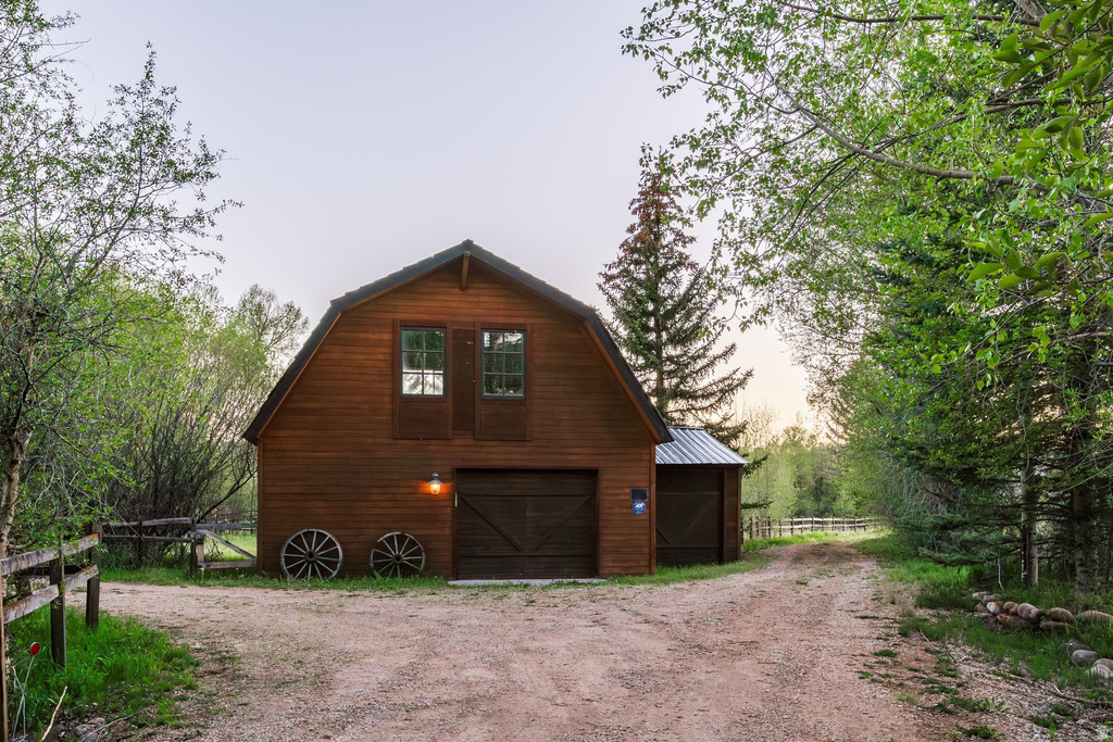 Rustic barn structure with wood siding and a gambrel roof