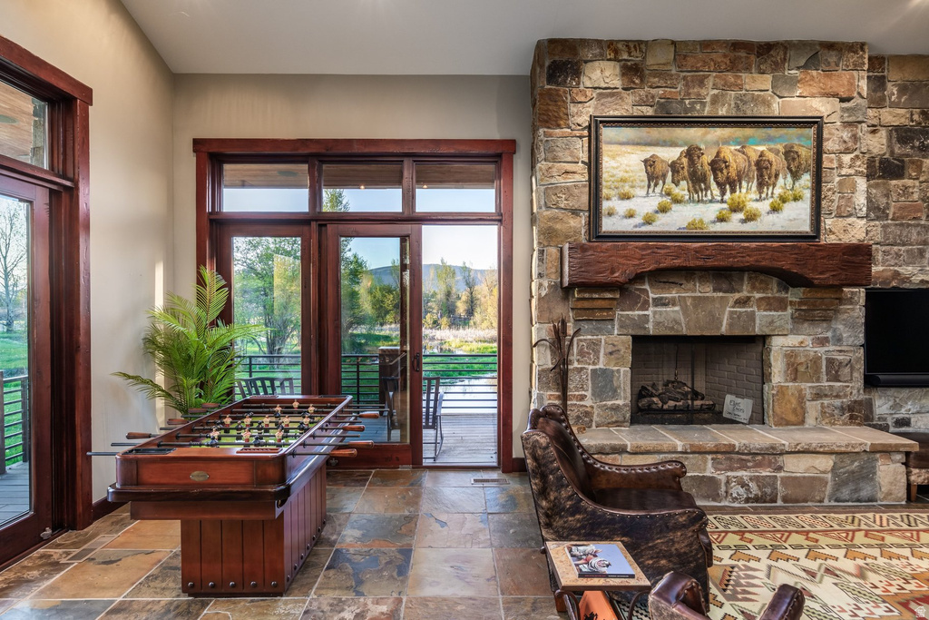 Stone fireplace with a substantial timber mantel