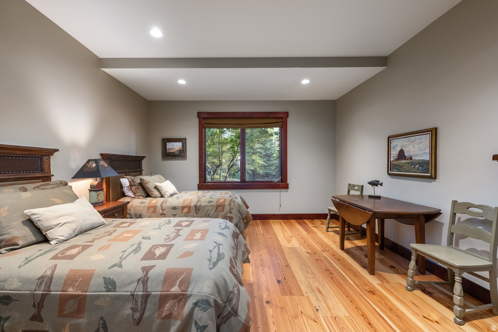 Room featuring wood-finish flooring and recessed lighting