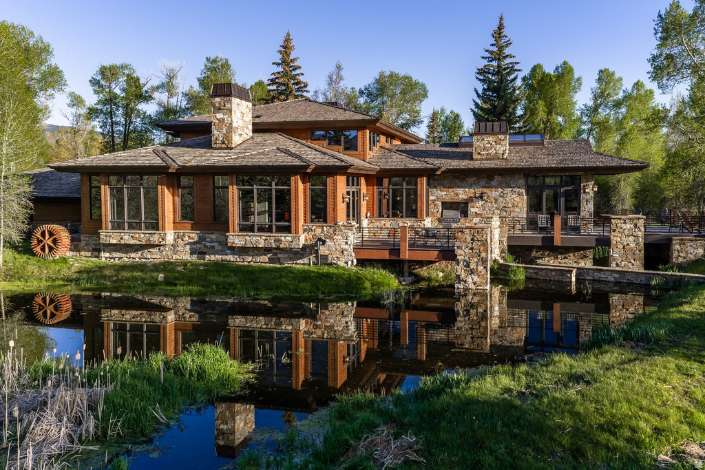 Stone and wood-clad exterior with a multi-level design
