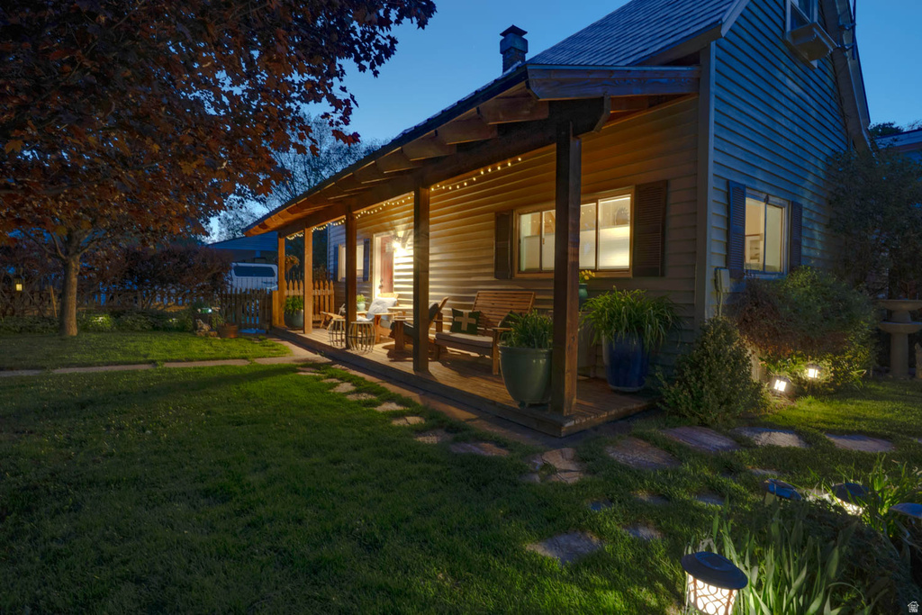 Front porch with exposed wood beams and plank flooring